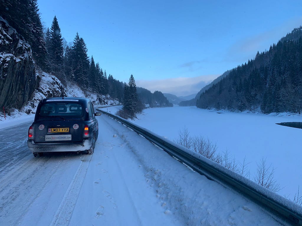 Taxi to Norway on a snowy road